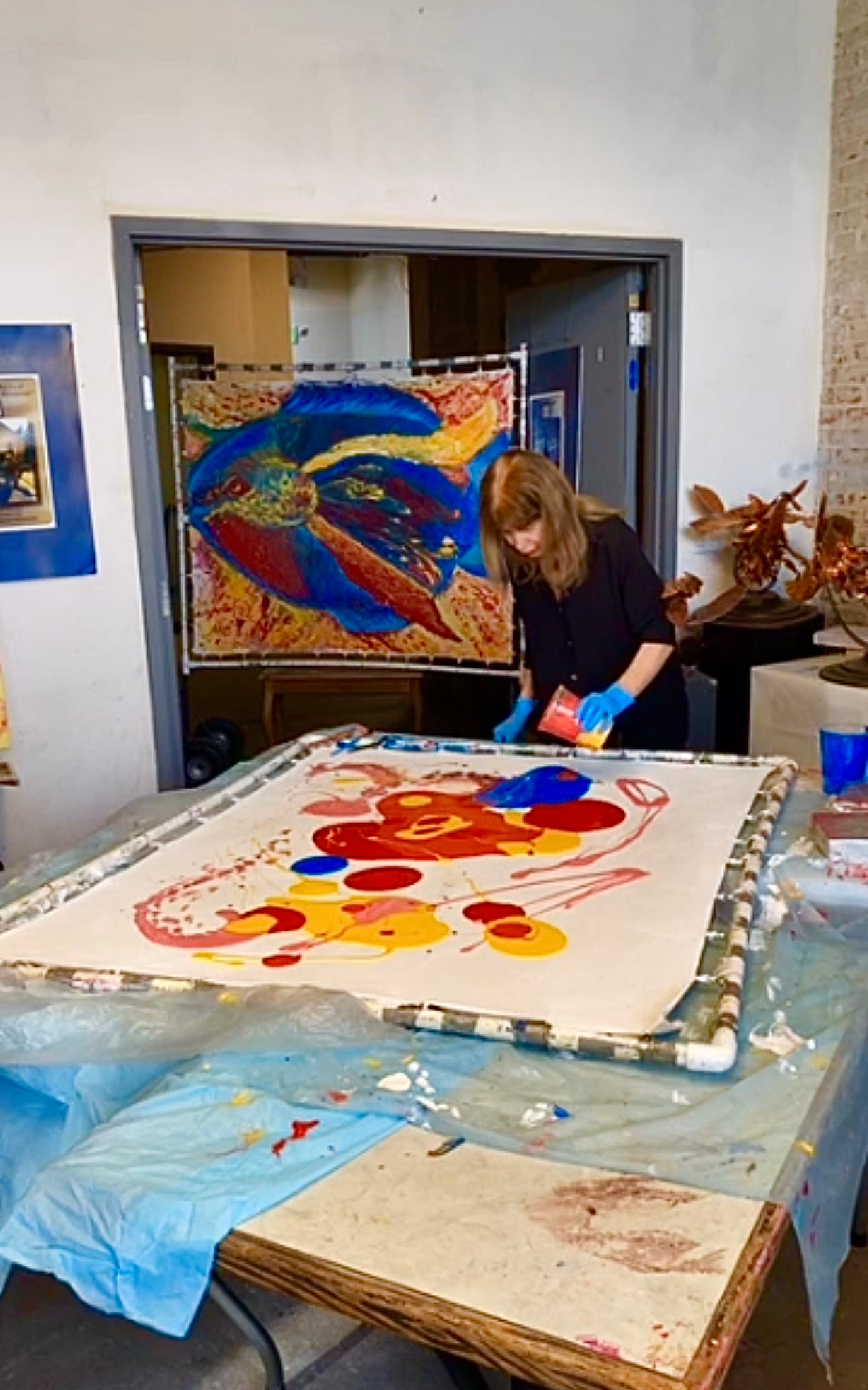 Here Shahla is creating an abstract painting with Acrylic paint on a French handmade paper.